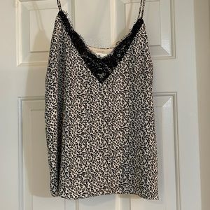 The perfect camisole! Wear under a jacket with black lace edge.